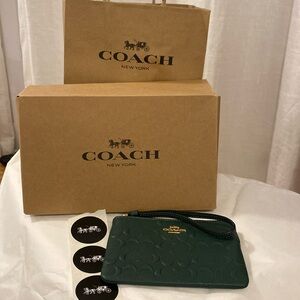Coach wallet. New with gift box, bag and authenticity card. Perfect for gift!